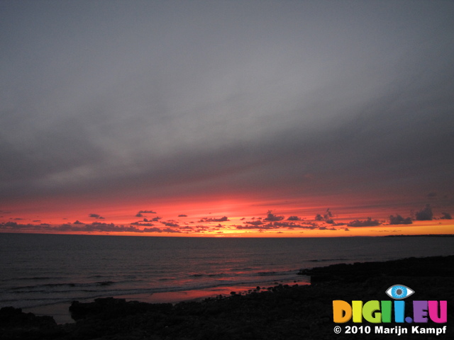 SX16497 Red and orange sky at sunset at Ogmore by Sea